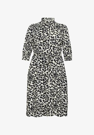 Obleka z leopardjim vzorcem v krem in črni barvi, z ovratnikom, gumbnim zapenjanjem in zategnjenim pasom s pasom za vezanje. Rokavi do tri četrtine.