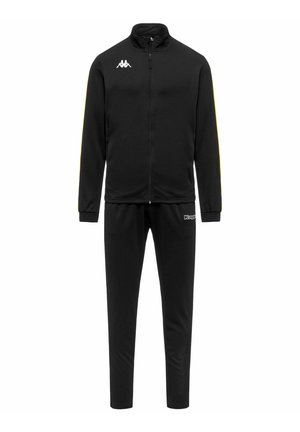 Tuta nera con zip completa con logo bianco sul petto della giacca e nome del marchio bianco sulla coscia dei pantaloni, con polsini elasticizzati e pantaloni slim fit.