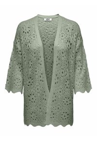 Lichtgroene opengehaakte cardigan met een V-hals, korte mouwen en gegolfde randen. Textuurpatroon met grote gaten overal.