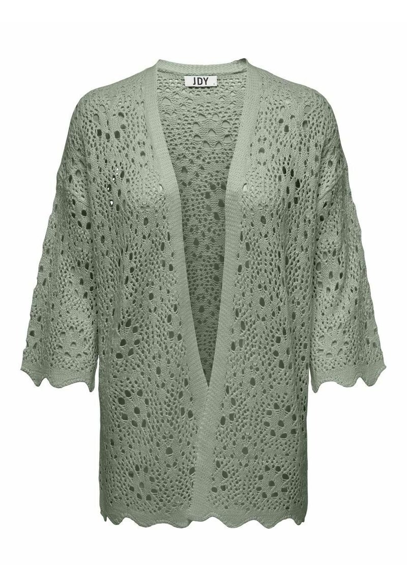 Lichtgroene opengehaakte cardigan met een V-hals, korte mouwen en gegolfde randen. Textuurpatroon met grote gaten overal.
