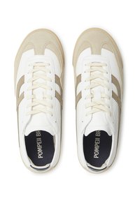 White and beige sneakers featuring a suede and leather upper, round toe, contrasting side stripes, and cream laces.