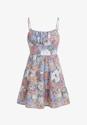 Robe d'été sans manches à volants avec bretelles fines réglables, avec un motif floral rose, blanc, jaune et vert sur fond bleu clair.