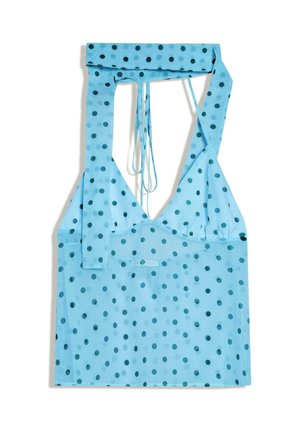 Top azzurro con collo allacciato al collo, con pois blu scuro e spalline annodate, mostrato disteso su sfondo bianco.