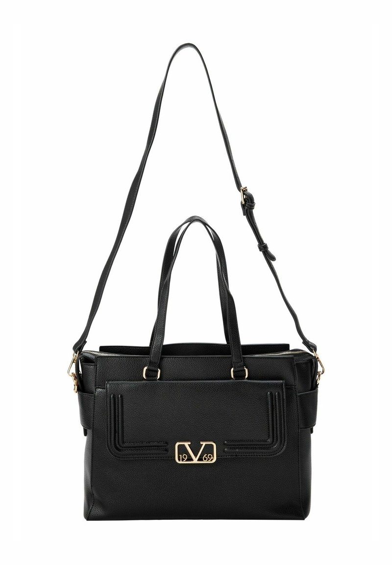 Sac à main en cuir noir avec deux poignées, bandoulière réglable, poche avant à rabat, et détails en métal doré pour le logo et la fermeture éclair.