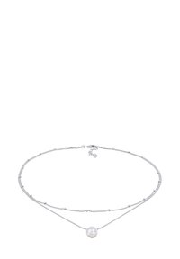 Silver layered necklace featuring two chains, one with small beads and another with a central round pendant. Smooth, shiny pearl-like detail.