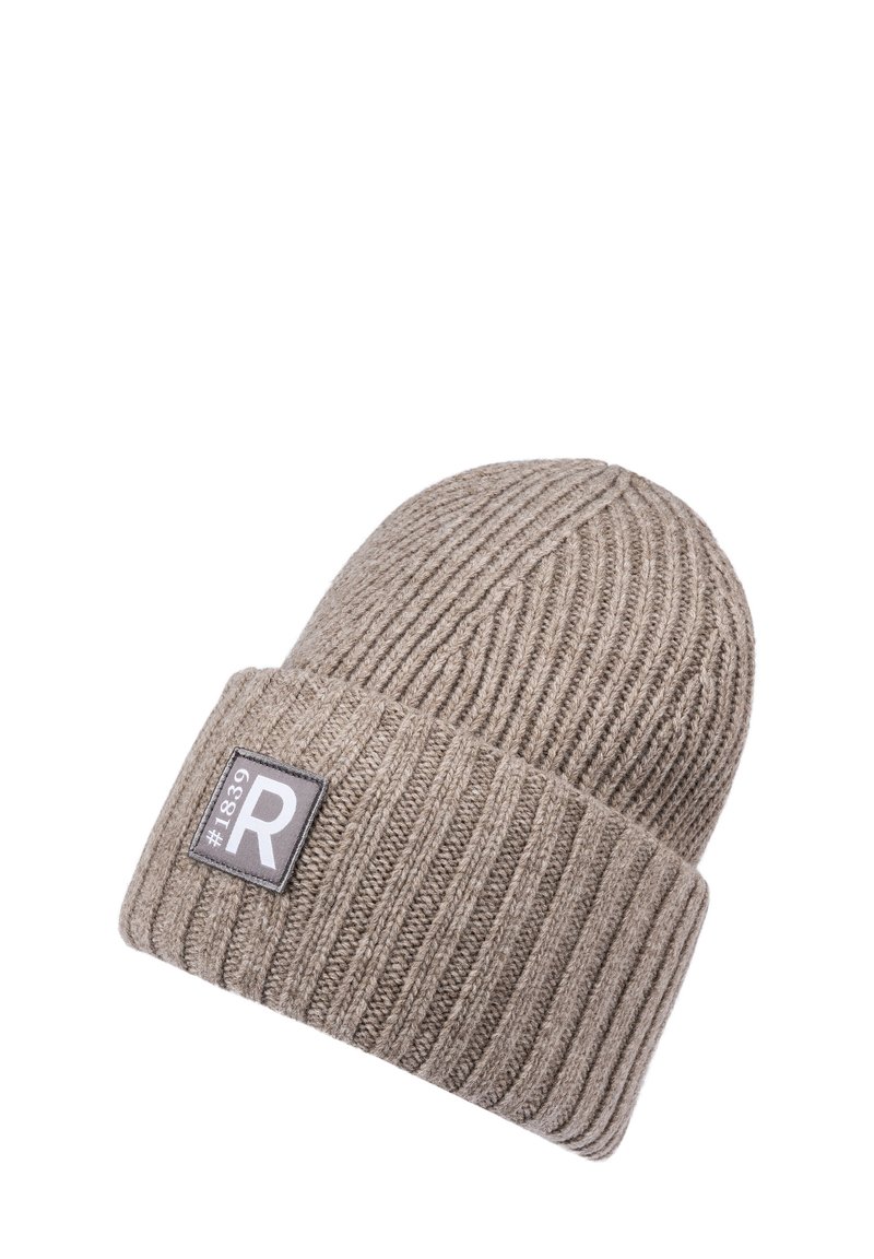 Beige ribbed knit beanie hat with folded cuff and a rectangular patch showing "#1839" and a large letter "R".