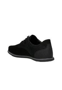 Black suede shoes with a smooth texture and rounded toe. Features a mesh panel at the heel and a rubber sole. Simple lace-up design.