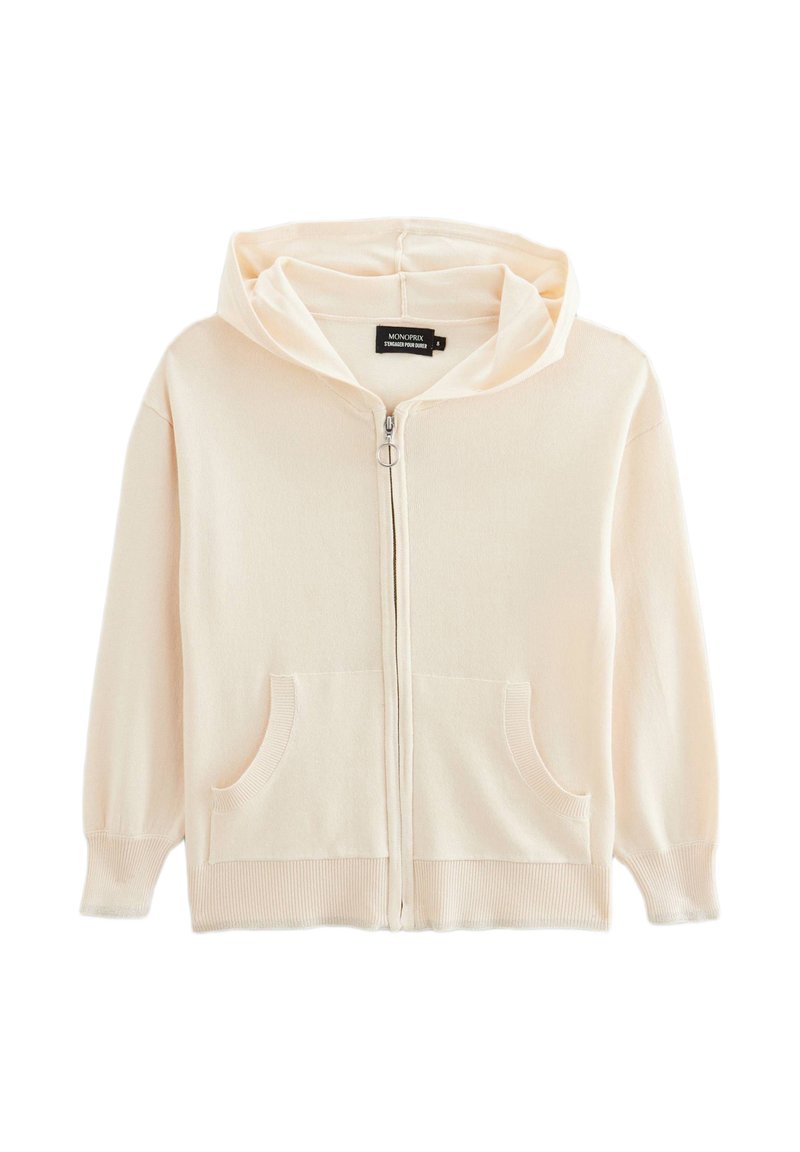Haut de sweat à capuche zippé beige clair en tissu doux, doté d'une capuche, de deux poches frontales, de poignets côtelés et d'une texture lisse avec des détails de conception minimaux.