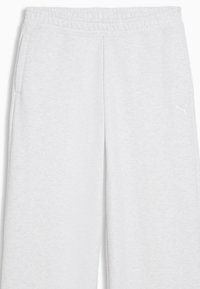 Ανοιχτό γκρί φόρμα με ελαστική μέση, πλαϊνές τσέπες και μικρό λευκό λογότυπο Puma στο δεξί μηρό.