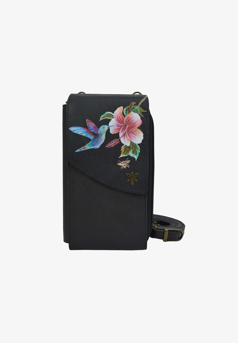 Black leather crossbody bag featuring a hummingbird and hibiscus floral design, gold hardware accents, and an adjustable strap.
