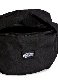 Mustat kangaskassi vyötärölle, jossa on vetoketjukiinnitys. Edessä on "Vans Off the Wall" -logo ja tilava sisus.
