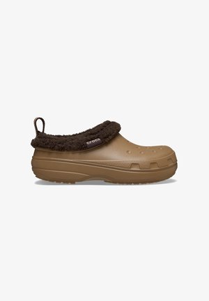 Brown Crocs with a plush brown fleece collar, rounded toe design, ventilation holes, and textured rubber sole for grip and comfort.