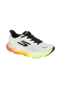 White mesh athletic shoe with black laces and logo, featuring a multicolor gradient sole in orange, yellow, and green. Textured surface detail.