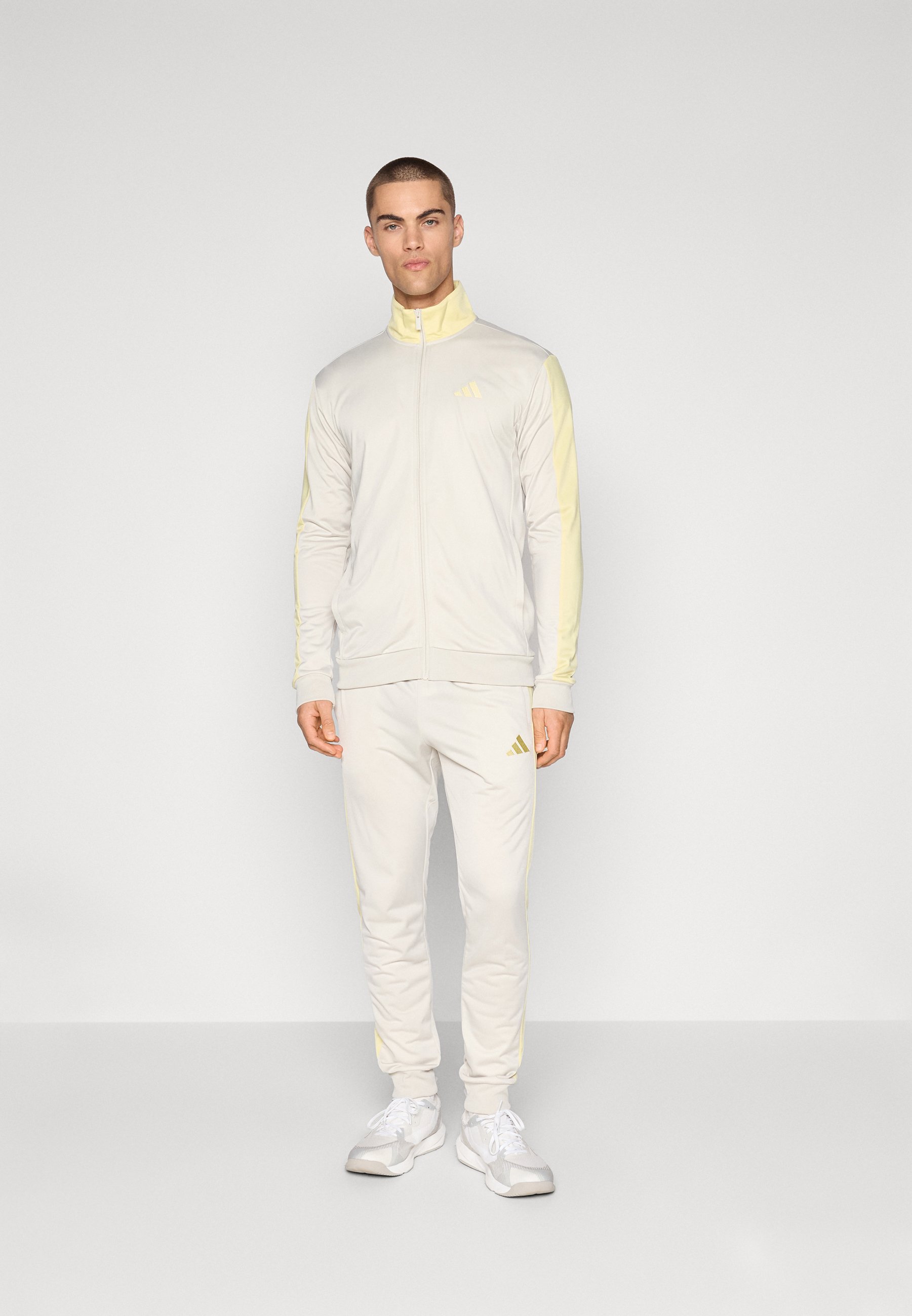 white gold adidas tracksuit