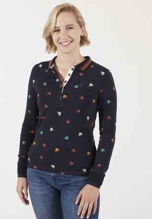 Polo à manches longues bleu marine avec des motifs en forme de cœur multicolores, col rayé et patte de boutonnage partielle. Tissu en coton doux.