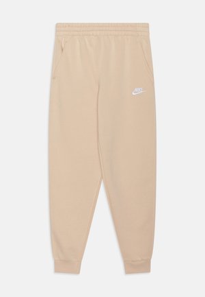 Beige Nike-Sweatpants mit elastischem Bund und Bündchen, seitlichen Taschen und weißem Nike-Logo auf dem linken Oberschenkel.