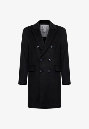 Cappotto doppio petto nero in lana con rever a incavo, sei bottoni, due tasche frontali con patta e un'etichetta dettagliata all'interno del colletto.