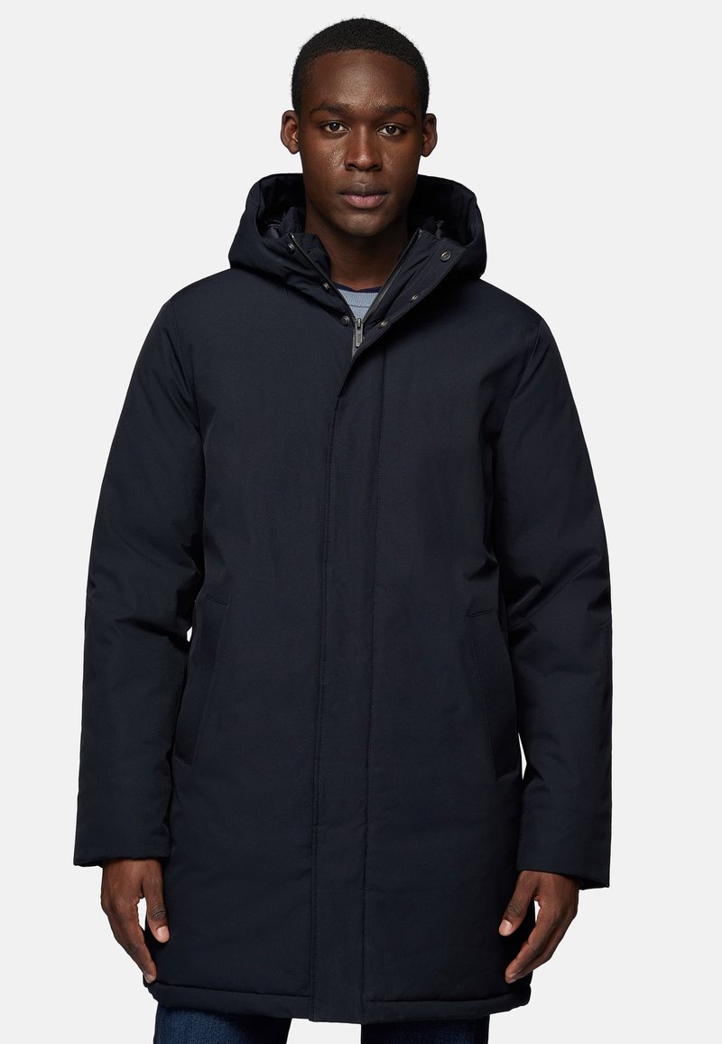Navy padded parka with a hood, featuring a front zipper, snap buttons, and side pockets, made from a smooth, water-resistant material.