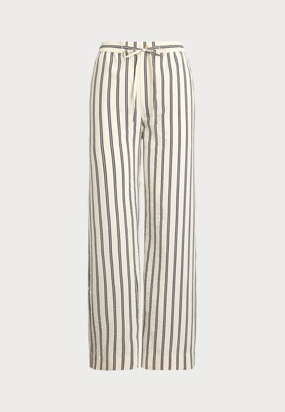 Pantalons larges en tissu crème avec des rayures verticales marine. Dotés d'une taille élastique avec cordon de serrage, offrant une coupe décontractée et une texture.