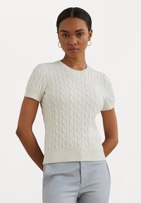 White cable-knit short-sleeve sweater with a round neckline and ribbed detailing. The material appears soft, with a fitted design.