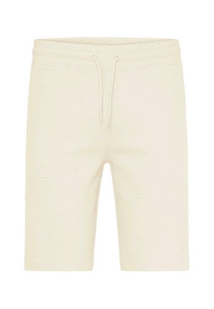 Gaiši bēšas šorti no teksturēta auduma ar elastīgu jostu un auklu. Apakšējā kājas daļā ir neliela logotipa detaļa.