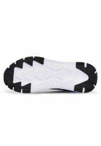 Svart och vit atletisk sko sula med ett texturerat gummimönster. Har hexagonala och triangulära former för grepp.