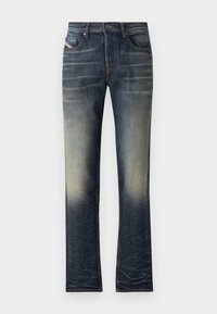 Denim jeans in a dark blue wash, featuring fading towards the bottom, five pockets, yellow stitching, and a button closure.