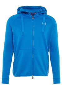 Modrá zipová bunda vyrobená z měkké látky, s předním zipem, dvěma velkými kapsami a kapucí se stahovacími tkaničkami.
