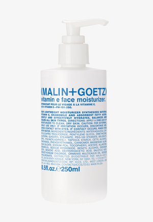 White pump bottle labeled "(MALIN+GOETZ) vitamin e face moisturizer" with blue text. 250ml capacity, smooth surface, simple design.