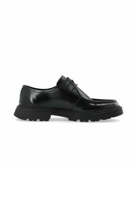 Schwarze Leder Schuhe mit glänzender Oberfläche, runder Zehenform, Schnürsenkeln und einer robusten, dicken Sohle mit rutschfesten Details.