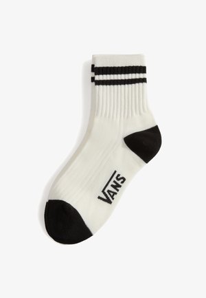 Calzino bianco con dettagli neri, caratterizzato da un design a costine, due strisce nere nella parte superiore e un logo Vans vicino alla zona delle dita.