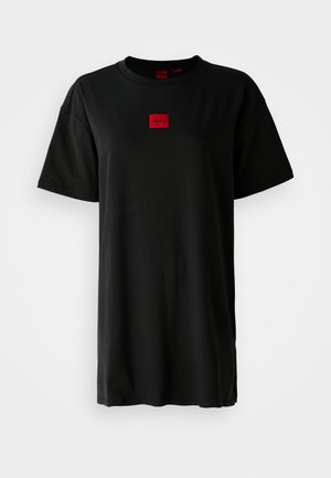 Black T-shirt made from cotton, featuring a red square logo patch on the chest. Short sleeves and a relaxed fit with a crew neckline.