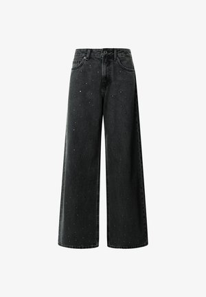 Black wide-leg jeans made of denim, featuring scattered metallic studs, a button front, and traditional pocket design.