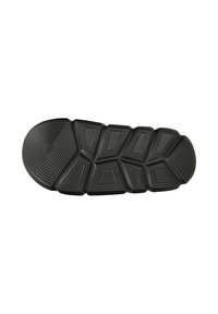Black outsole with geometric shapes and ridged texture. Features multiple angled segments for grip and traction, smooth rounded edges.