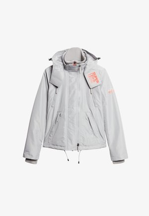 Light gray winter jacket with high collar, zipper front, drawstrings, side pockets, and orange "Superdry" logo on shoulder and flap.