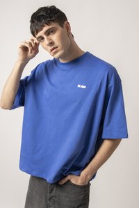 Royal blue short-sleeve t-shirt made of cotton, featuring a crew neckline and a small white logo on the left chest. Smooth texture.