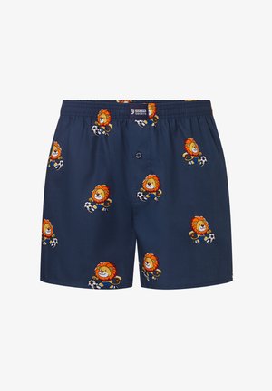 Marineblaue Boxershorts mit orangefarbenen Cartoon-Löwen, die Fußball spielen, bedruckt und einem elastischen Bund mit einem vorderen Knopf.