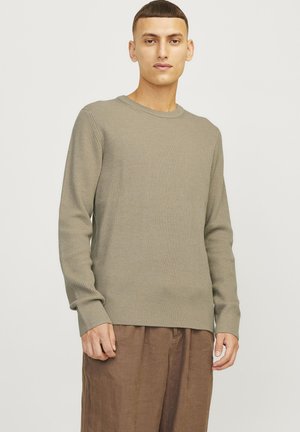 Olive ribbed long-sleeve sweater with a crew neck, made of textured fabric, featuring a relaxed fit and side slits at the hem.