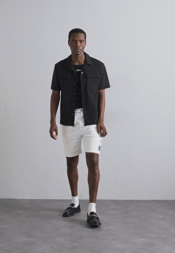 BERMUDA - Tracksuit bottoms - bianco ottico4