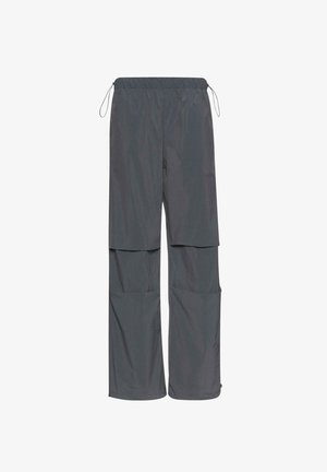 Siva, lagana, vodootporna hlače s elastičnim strukom i podesivom špagom. Ima dvije velike hlačne džepove. Dizajn s opuštenim krojem.