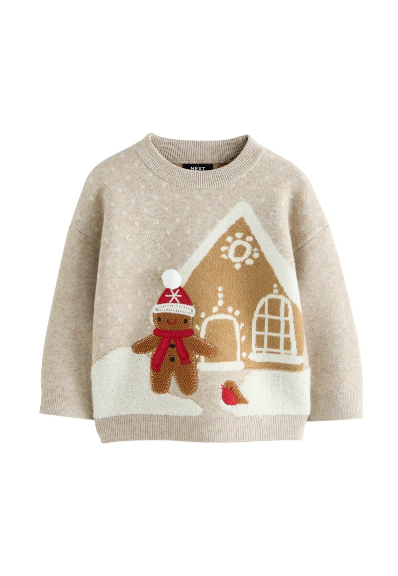 Pull beige pour enfants avec un personnage en pain d’épices portant un chapeau rouge et une écharpe, une maison en pain d’épices et un petit oiseau dans la neige.