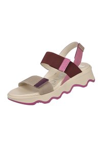 Sandal con suela beige, acentos en rosa y correas elásticas marrones. Diseño de suela ondulada y característica de punta abierta para ventilación. Textura suave.