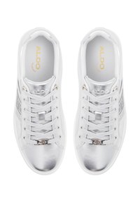 White sneakers with metallic silver accents, featuring a smooth texture, laces, and branded insole. Reinforced toe and padded collar.