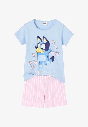 Light blue short-sleeve top with dancing cartoon blue dog and pink flowers, paired with pink and white striped shorts.