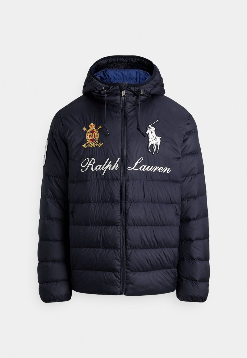 Navy blue quilted puffer jacket with hood, front zipper, embroidered polo player logo, "Ralph Lauren" text, and crest patch on chest.