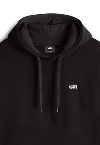 Felpa nera con cappuccio e lacci, caratterizzata da un piccolo logo bianco Vans sul petto. Realizzata in un tessuto morbido con una texture liscia.