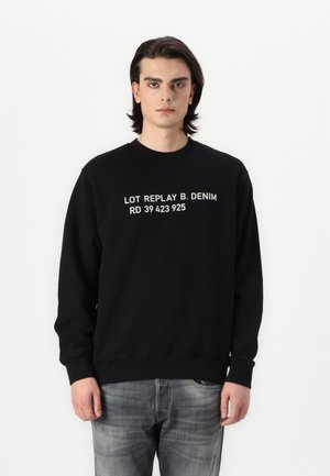 Black sweatshirt with a crew neckline and long sleeves, featuring white printed text: "LOT REPLAY B. DENIM RD 39 423 925."