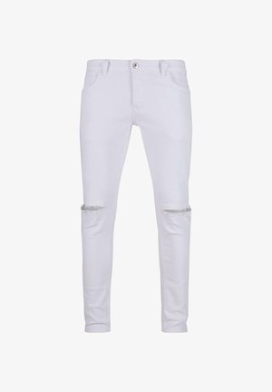 Fehér farmernadrág slim fit szabással, szakított térdekkel, klasszikus öt zsebes dizájnnal és hagyományos gombos és cipzáras záródással.