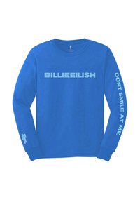Blue long-sleeve shirt featuring bold white text: "BILLIEEILISH" on front, "DON'T SMILE AT ME" on sleeve, and a small icon on the cuff.