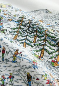 Colorful fabric featuring a winter skiing scene with snow-covered trees, skiers in diverse clothing, and a snowy landscape.